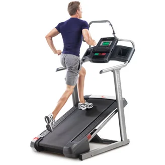 Man running uphill on a treadmill set to a steep incline