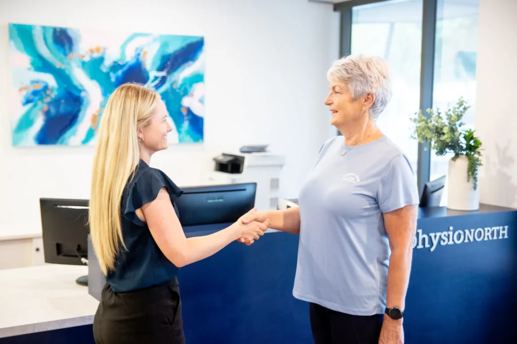 Reception welcoming a patient at the front desk